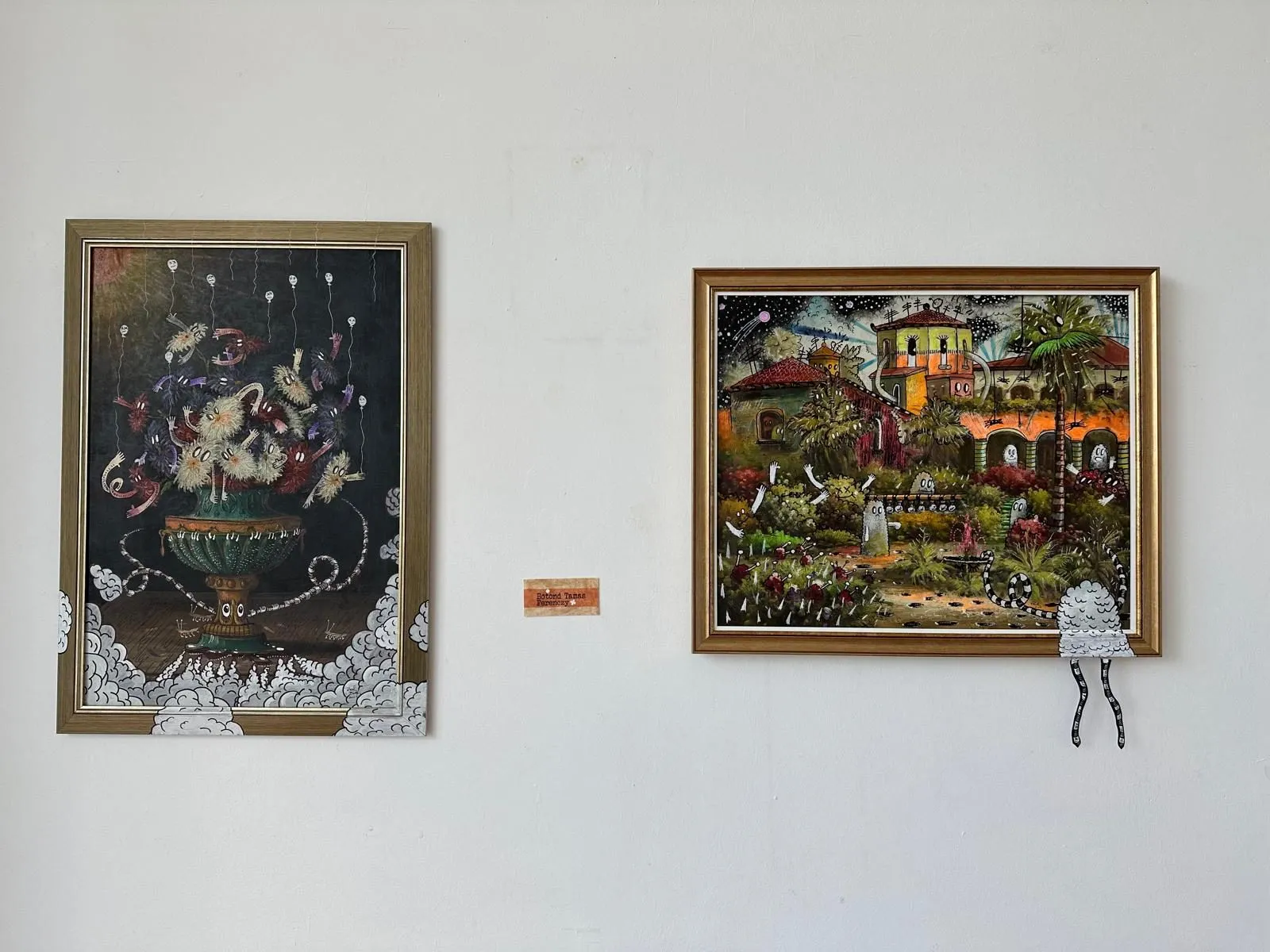 Vase of creatures and Villa with ghosts side by side, creature legs hanging below the villa frame